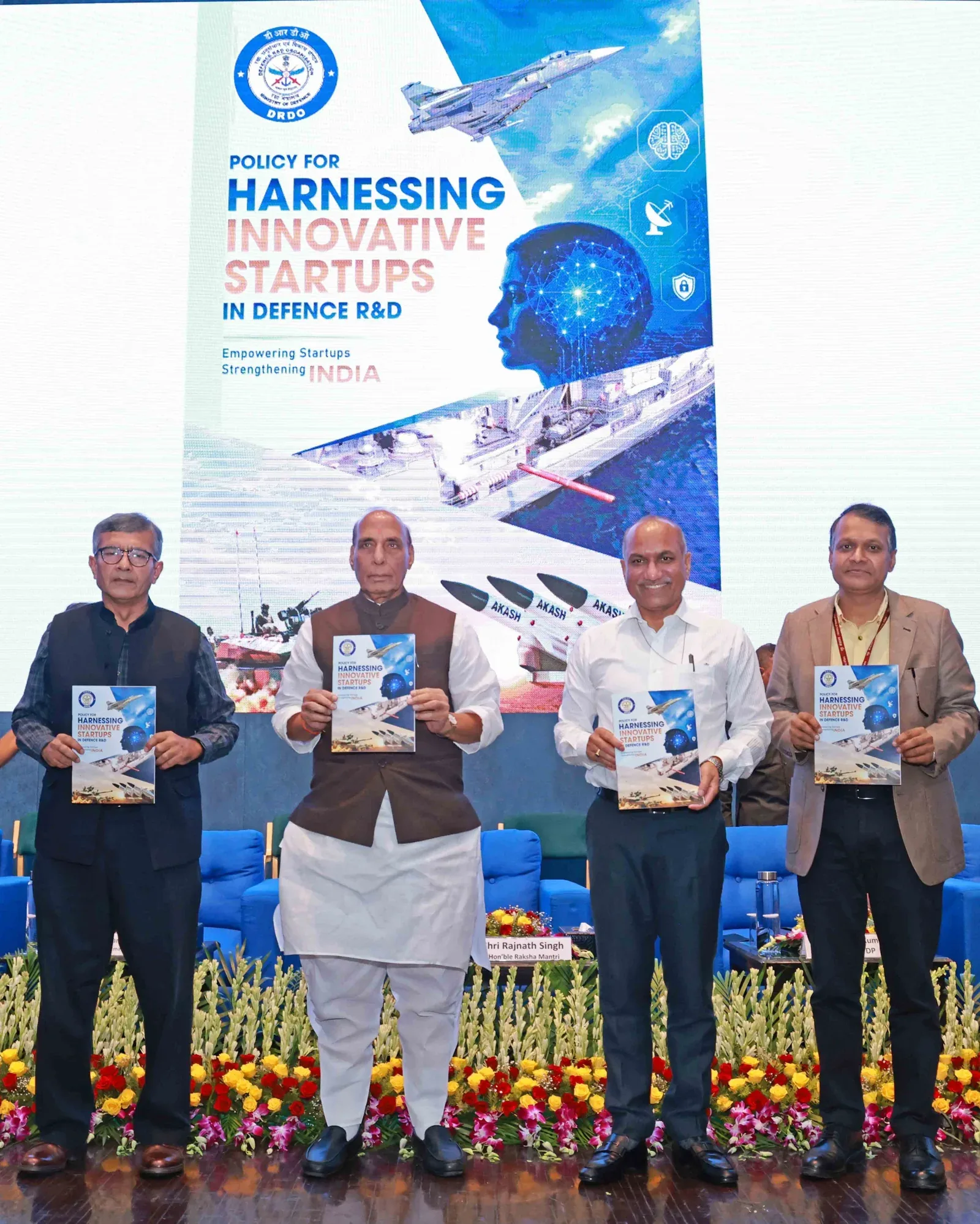 Rajnath Singh and officials holding the startup policy document at VIMARSH 2026